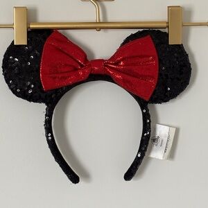Disney Parks Minnie Mouse black sequined ear headband with a red sequin bow